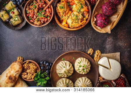 Traditional Georgian Cuisine Background. Khinkali, Phali, Chahokhbili, Lobio, Cheese, Eggplant Rolls