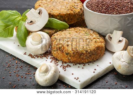 Tasty Vegetarian And Vegan Burgers Made From Healthy Quinoa, Basil, Tomatoes And Champignon Mushroom