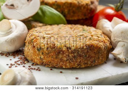 Tasty Vegetarian And Vegan Burgers Made From Healthy Quinoa, Basil, Tomatoes And Champignon Mushroom