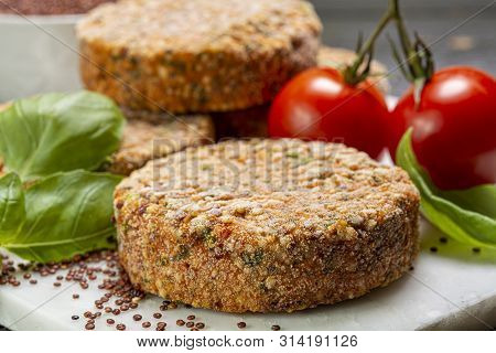 Tasty Vegetarian Burgers Made From Healthy Quinoa, Basil, Tomatoes And Mozzarella Cheese