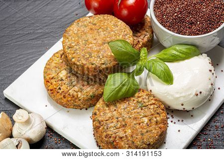 Tasty Vegetarian Burgers Made From Healthy Quinoa, Basil, Tomatoes And Mozzarella Cheese