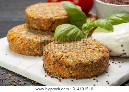 Tasty Vegetarian Burgers Made From Healthy Quinoa, Basil, Tomatoes And Mozzarella Cheese