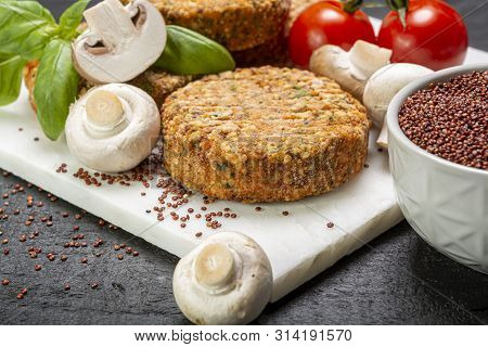 Tasty Vegetarian And Vegan Burgers Made From Healthy Quinoa, Basil, Tomatoes And Champignon Mushroom