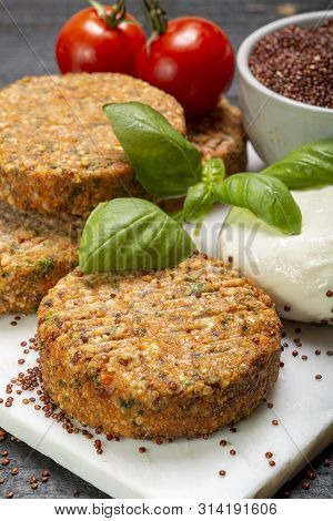 Tasty Vegetarian Burgers Made From Healthy Quinoa, Basil, Tomatoes And Mozzarella Cheese