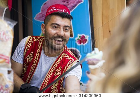 Istanbul, Turkey - June 15, 2019: Unidentified Seller Of Turkish Ice Cream At Istanbul, Turkey. Trad