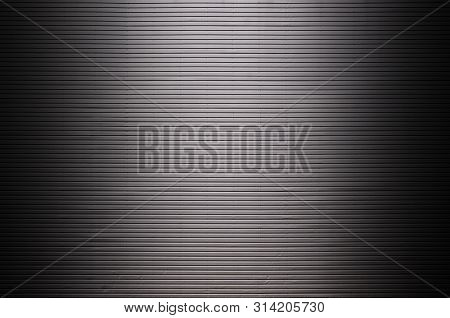 Metal Wall With Invisible Light Sources That Illuminate The Midd