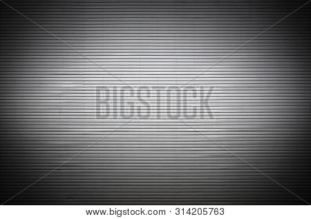 Metal Wall With Invisible Light Sources That Illuminate The Midd