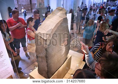 London, Uk - July 14, 2019: People Visit Rosetta Stone In British Museum, London. The Museum Was Est