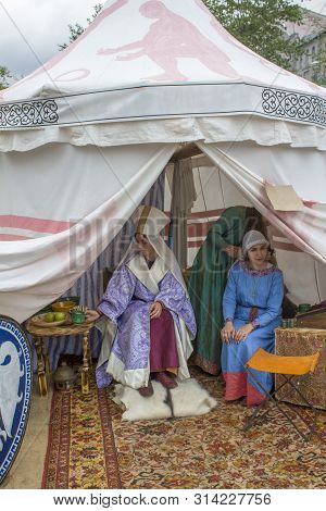 Moscow/ Russia - 15.06.2019: The Princess And The Maid In Ancient Historical Dresses Sit On The Brig
