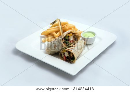 A Low Contrast Hero Shot Of A Chicken Pimiento Sandwich With Samurai & Alger Sauce & Fries On The Si