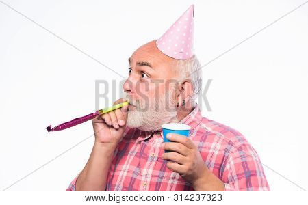 Birthday Concept. Ideas For Seniors Birthday Celebrations. Grandfather Graybeard Blowing Party Whist