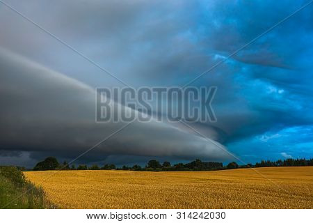 Storm Clouds With Shelf Cloud And Intense Rain