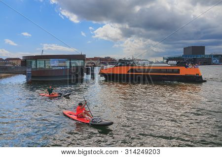 Copenhagen, Zealand Denmark - July 21 2019: Yellow Public Transportation Boat Bus At Copenhagen On D