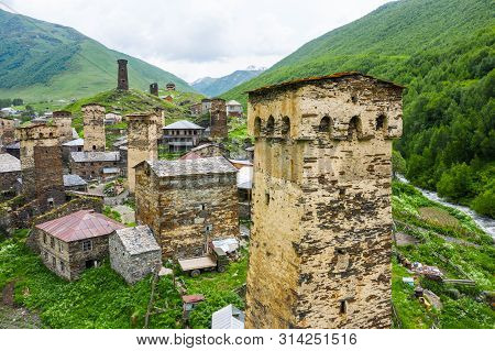 View Of The Ushguli Village At The Foot Of Mt. Shkhara. Picturesque And Gorgeous Scene. Rock Tower T