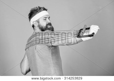 Try Stretching Exercise. Athlete Sport Instructor. Athlete Workout With Expander. Sportsman Training