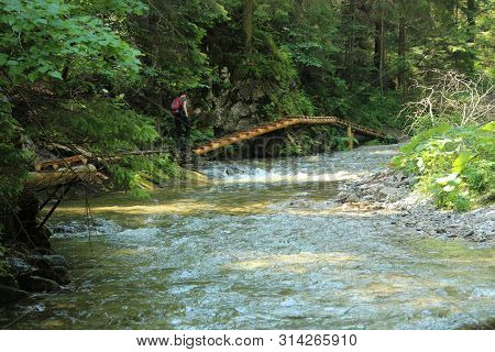 A Tourist In The Beautiful Gorges Of The Slovak Paradise National Park
