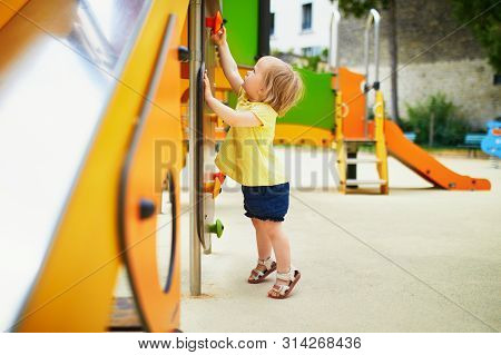 Adorable Toddler Girl Near Playground Slide. Outdoor Activities For Kids