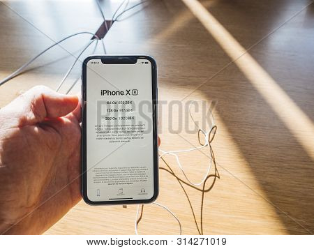 Paris, France - Oct 26, 2018: Man Hand Holding Latest Iphone Xr Smartphone During Launch Day Manufac