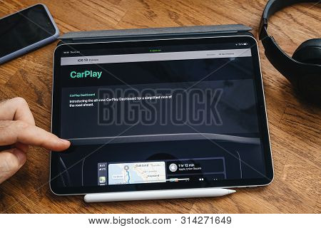 Paris, France - Jun 6, 2019: Man Reading On Apple Ipad Pro Tablet About Latest Announcement Of At Ap