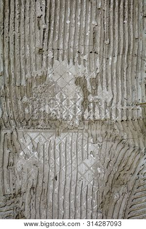 Rusty Concrete Surface With Striped Relief. Texture With Engraved Lines On Urban Cement Wall. Txture