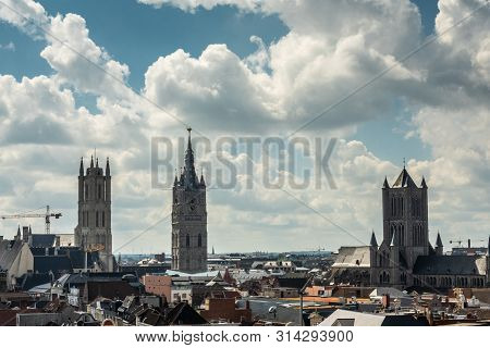 Gent, Flanders, Belgium -  June 21, 2019: Shot From Castle Tower, View Over City Roofs Shows Three M