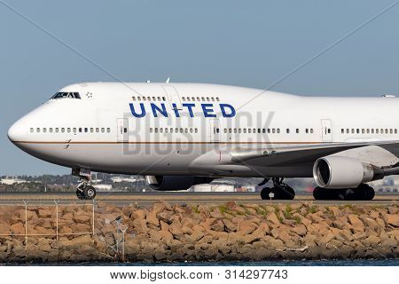 Sydney, Australia - October 10, 2013: United Airlines Boeing 747 Jumbo Jet Airliner On The Runway At