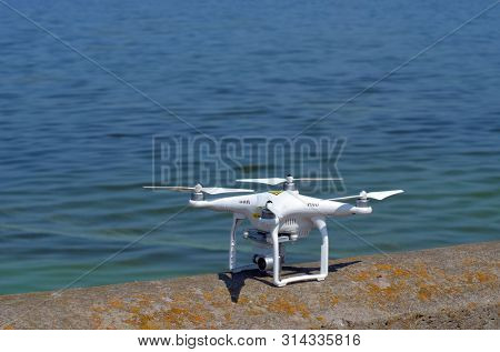 Drone quadrocopter DJI Phantom 3 Pro explores storage pool of hydroelectric station. After Chernobyl disaster - collection active sediments. Dnepr river. July 29, 2019.Kiev ,Ukraine 