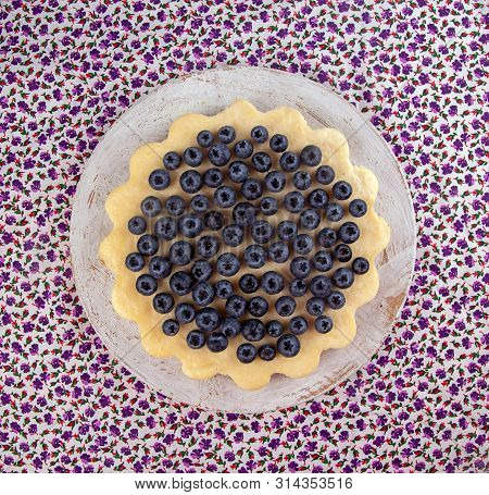 Homemade Cheesecake Decorated With Blueberry Over On Fabric. Top View