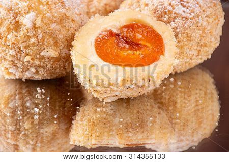 Austrian And Czech Sweet Dessert Knedles Apricot Dumplings With Reflection. Filled Cottage Cheese Do