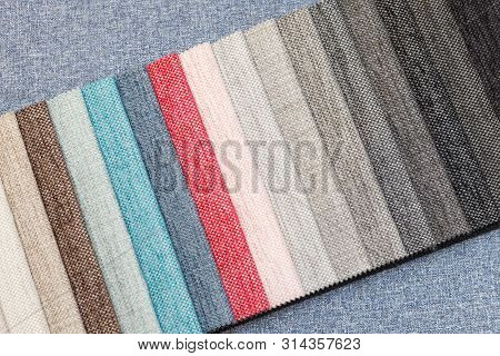 Multi-colored Samples Of Upholstery Fabric For Sofas And Chairs Close-up. Selection Of Fabric For In
