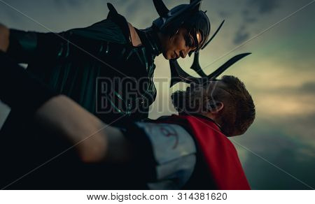 Dnipro, Ukraine- June 5, 2019: Cosplayers Portray Battle Of Goddess Of Death Hela And Superhero Thor