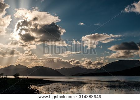 Sun Rays Filtering Through Clouds Over Loch Linnhe In Scotland