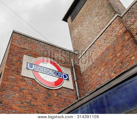 London / Uk - June 15th 2019 - Underground Sign Outside Wood Green Station On The Piccadilly Line, I