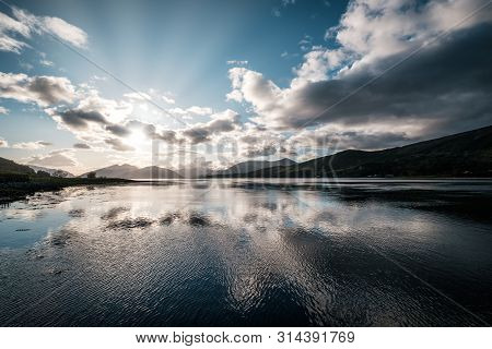Sun Rays Filtering Through Clouds Over Loch Linnhe In Scotland