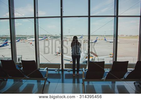 Girl With A Backpack At The Airport Window Sheremetyev