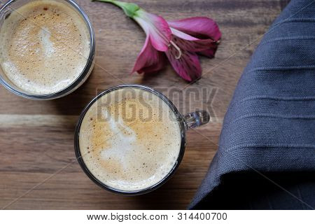 Capuccino Coffee Made By Barista With Flower Decoration