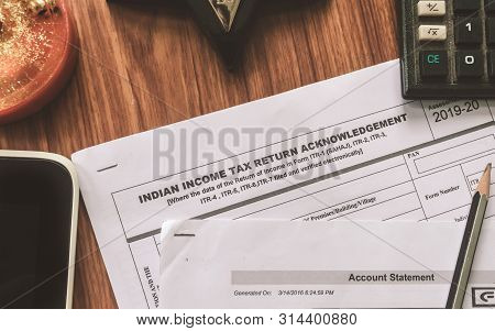 Close Up Of Indian Income Tax Return Form Itr-2 Return Form Is On The Table Next To A Pen, Calculato