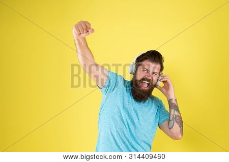 Wireless Headphones Deliver Clean Sound. Hipster Happy Using Modern Wireless Headphones. Freedom Goi