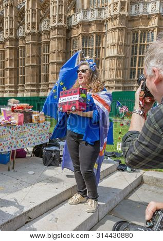 London / Uk - June 26th 2019 - Pro-eu Anti-brexit Protester Holding A Model Bus Entitled Boris Made 
