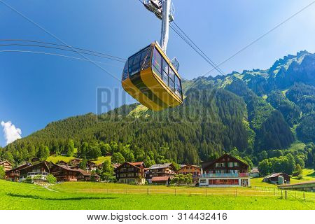 Cable Car From Mountain Village Wengen To Viewpoint On Cliff In Mannlichen, Switzerland, Bernese Obe