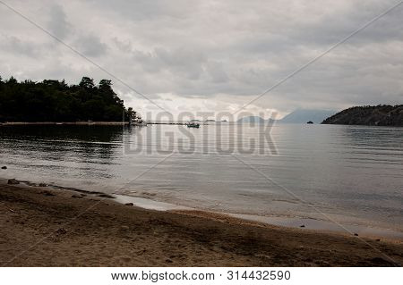 Landscape Fof The Seacoast On The Background Of Sky And Forest