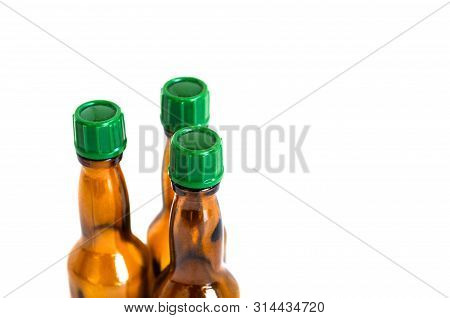 Side Perspective Shoot Of Brown Liquour Bottles With White Background