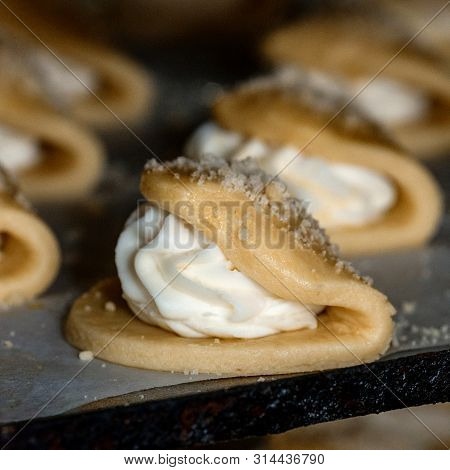 Finished Production Raw Sochniki Sochni With Cottage Cheese In Factory In The Steel Table. Tradition