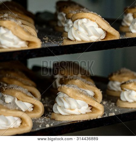 Finished Production Raw Sochniki Sochni With Cottage Cheese In Factory In The Steel Table. Tradition