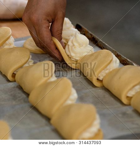 Finished Production Raw Sochniki Sochni With Cottage Cheese In Factory In The Steel Table. Tradition
