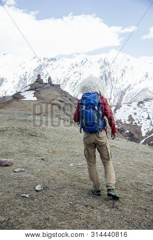 View At Young Hiker With Traditional Papakha Fur Hat At High Latitude Mountains At Mtskheta-mtianeti