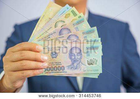 Money In Vietnam Hold On Hand Business Man Wearing A Blue Suit (socialist Republic Of Vietnam), Dong