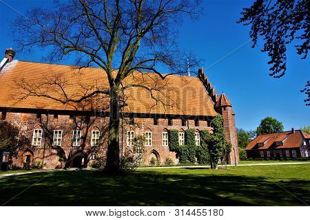 The Beautiful Wienhausen Abbey With Surrounding Park And Big Tree