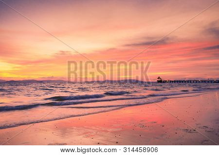 View Of Beautiful Sky Of Sea And Wave That Are Breaking Into The Beach And  Reflection Of The Sky At