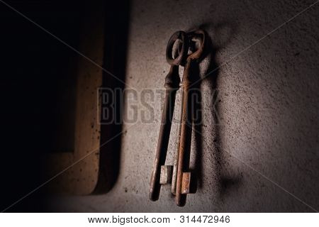 Old Rusted Keys Hanging On The Wall